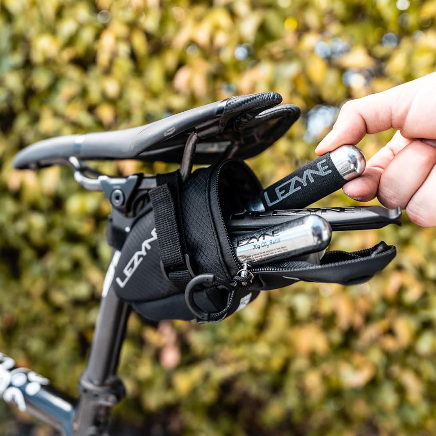 imageLEZYNE Caddy Bike Saddle Bag Durable Nylon Cycling Storage Bag with VelcroQuick Release Mount Reflective Accents WaterResistant Zipper for Road Bikes ampamp CommutersMedium