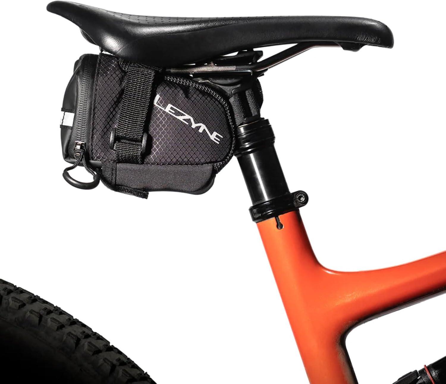 imageLEZYNE Caddy Bike Saddle Bag Durable Nylon Cycling Storage Bag with VelcroQuick Release Mount Reflective Accents WaterResistant Zipper for Road Bikes ampamp CommutersMedium